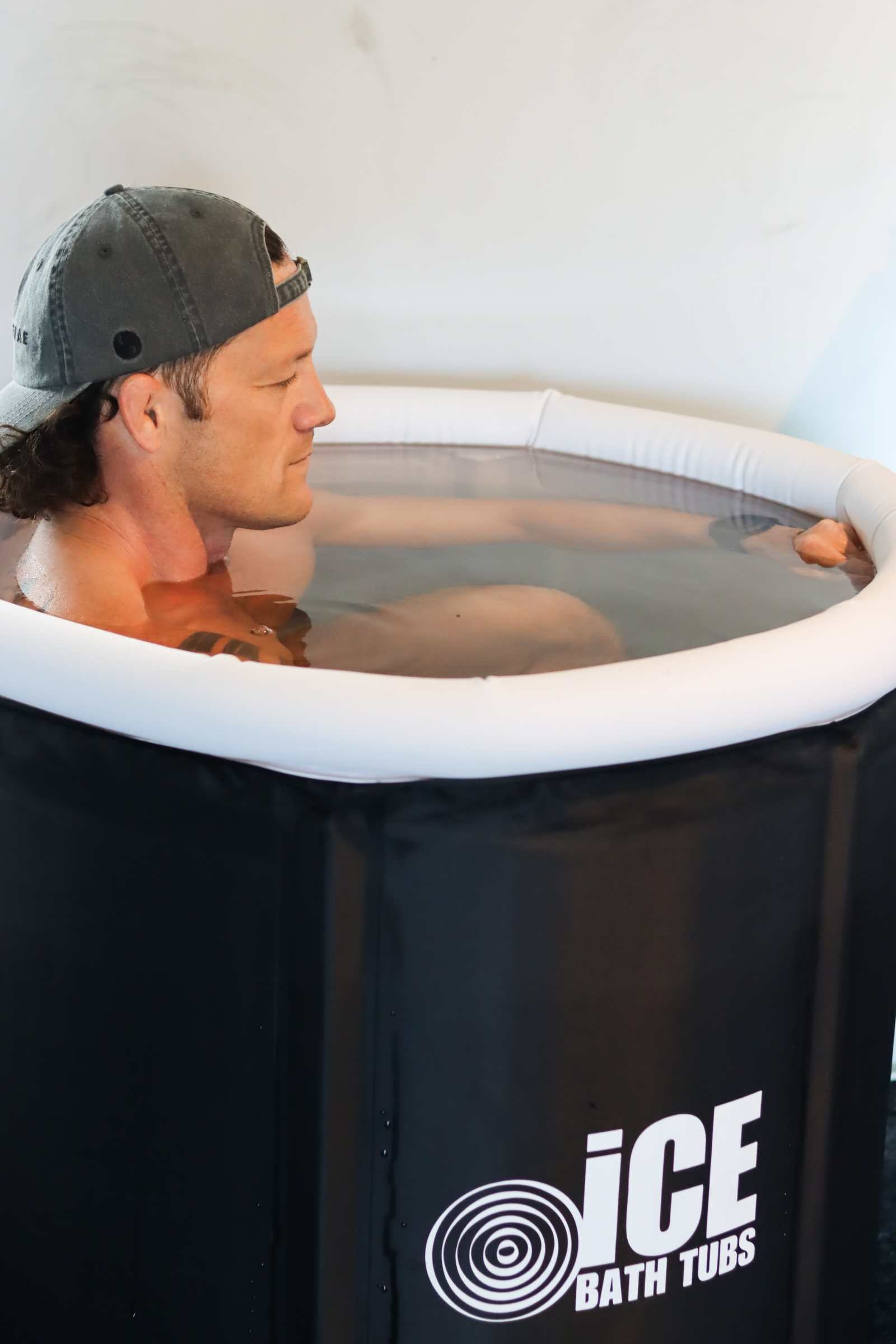 person taking an ice bath with the best ice bath chiller